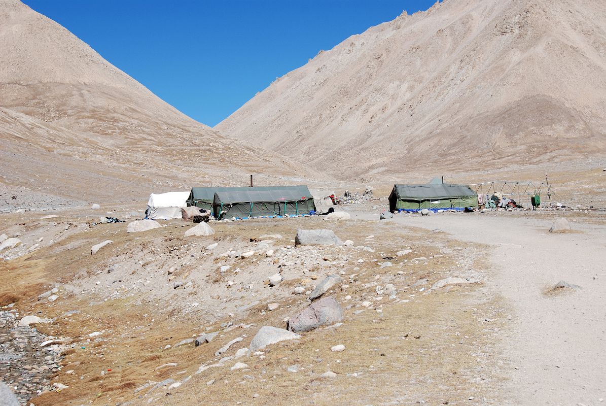 24 Tamdrin Seasonal Food And Beverage Tents In The Lha Chu Valley On Mount Kailash Outer Kora We stopped for a small lunch at the Tibetan seasonal nomad tents of Tamdrin (4893m) in the Lha Chu Valley. Tamdrin is named for the nearby self-arising image of Tamdrin (Hayagriva) on a rock.